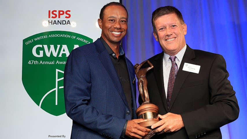 AUGUSTA, GEORGIA - APRIL 10: Tiger Woods of the United States is presented with the Ben Hogan Award by Bob Harig of ESPN during the Golf Writers Association of America 47th Annual Awards Dinner on April 10, 2019 in Augusta, Georgia. (Photo by David Cannon/Getty Images)