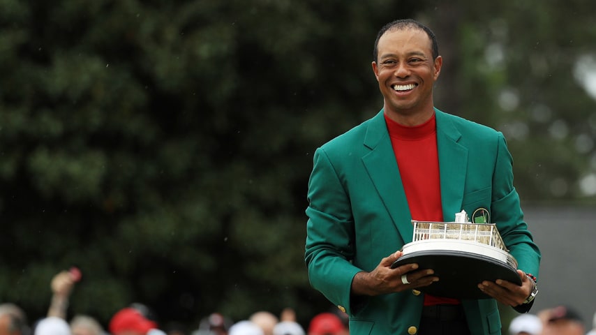 AUGUSTA, GEORGIA - APRIL 14: Tiger Woods of the United States celebrates with the Masters Trophy during the Green Jacket Ceremony after winning the Masters at Augusta National Golf Club on April 14, 2019 in Augusta, Georgia. (Photo by Mike Ehrmann/Getty Images)