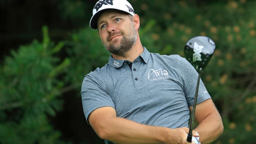 Ryan Moore shoots 65, leads by 1 at the Memorial