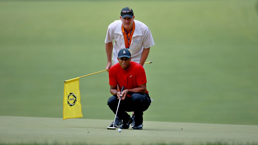 DUBLIN, OHIO - JUNE 02: Tiger Woods lines up a putt with his caddie, Joe LaCava, on the second hole during the final round of The Memorial Tournament Presented by Nationwide at Muirfield Village Golf Club on June 02, 2019 in Dublin, Ohio. (Photo by Matt Sullivan/Getty Images)