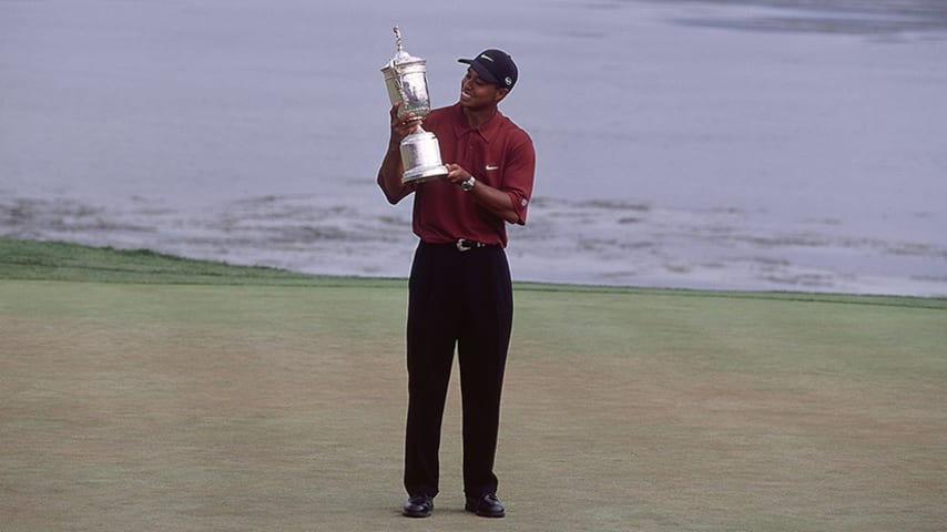 18 Jun 2000:  Tiger Woods of the USA poses with the winning trophy after winning the 100th US Open held at the Pebble Beach Golf Links, in Pebble Beach, California. \ Mandatory Credit: David Cannon /Allsport