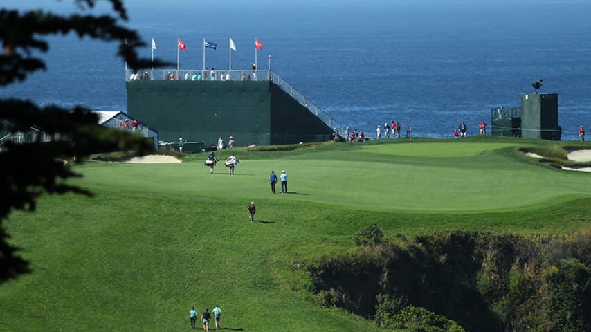 PEBBLE BEACH, CALIFORNIA - JUNE 11: A general view of the golfers walking up the 6th hole green during a practice round prior to the 2019 U.S. Open at Pebble Beach Golf Links on June 11, 2019 in Pebble Beach, California. (Photo by Warren Little/Getty Images)