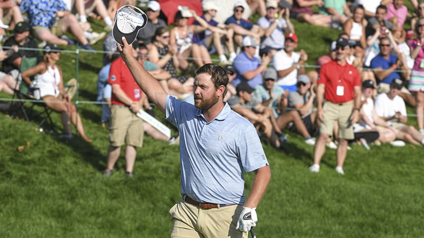 CROMWELL, CT - JUNE 23: Zack Sucher acknowledges the gallery on the 18th hole during the final round of the Travelers Championship at TPC River Highlands on June 23, 2019 in Cromwell, Connecticut. (Photo by Stan Badz/PGA TOUR via Getty Images)