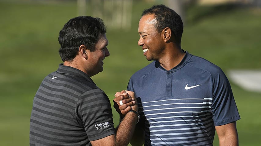 SAN DEIGO, CA - JANUARY 26: Tiger Woods shakes hands with Patrick Reed on the ninth hole after finishing the second round of the Farmers Insurance Open at Torrey Pines South on January 26, 2018 in San Diego, California. (Photo by Stan Badz/PGA TOUR)