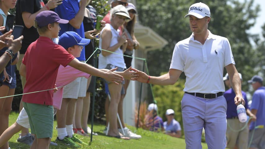 MEMPHIS, TN - JULY 28: Justin Thomas slaps hands with fans on the first hole during the final round of the World Golf Championships-FedEx St. Jude Invitational at TPC Southwind on July 28, 2019 in Memphis, Tennessee. (Photo by Stan Badz/PGA TOUR via Getty Images)