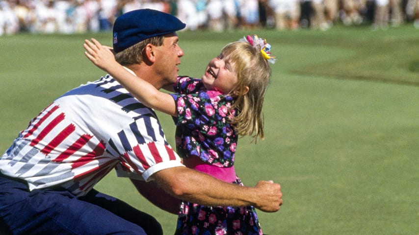 Payne Stewart of the United States hugs his daughter Chelsea after winning the US Open Golf Championship held at the Hazeltine Golf Club in Minnesota on 17th June 1991.  He beat Scott Simpson in a playoff.  (Photo by Phil Sheldon/Popperfoto via Getty Images/Getty Images)