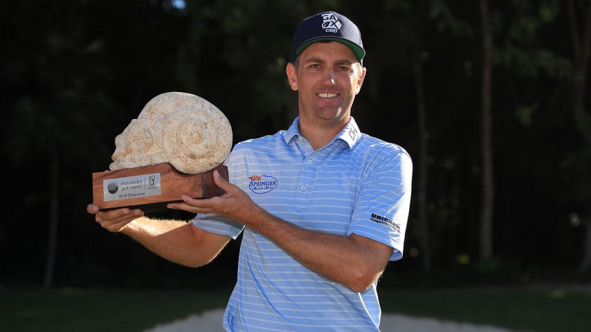 PLAYA DEL CARMEN, MEXICO - NOVEMBER 18: Brendon Todd of the United States celebrates with the trophy on the 18th green after winning the Mayakoba Golf Classic at El Camaleon Mayakoba Golf Course on November 18, 2019 in Playa del Carmen, Mexico. (Photo by Gregory Shamus/Getty Images)