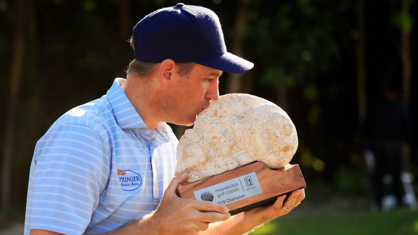 PLAYA DEL CARMEN, MEXICO - NOVEMBER 18: Brendon Todd of the United States celebrates with the trophy on the 18th green after winning the Mayakoba Golf Classic at El Camaleon Mayakoba Golf Course on November 18, 2019 in Playa del Carmen, Mexico. (Photo by Cliff Hawkins/Getty Images)