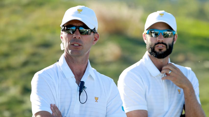 JERSEY CITY, NJ - SEPTEMBER 28: (L-R) Mike Weir of Canada and Captains Assistant of the International Team and Adam Hadwin look on during the Thursday foursomes matches of the first round of the Presidents Cup at Liberty National Golf Club on September 28, 2017, in Jersey City, New Jersey. (Photo by Scott Halleran/PGA TOUR)