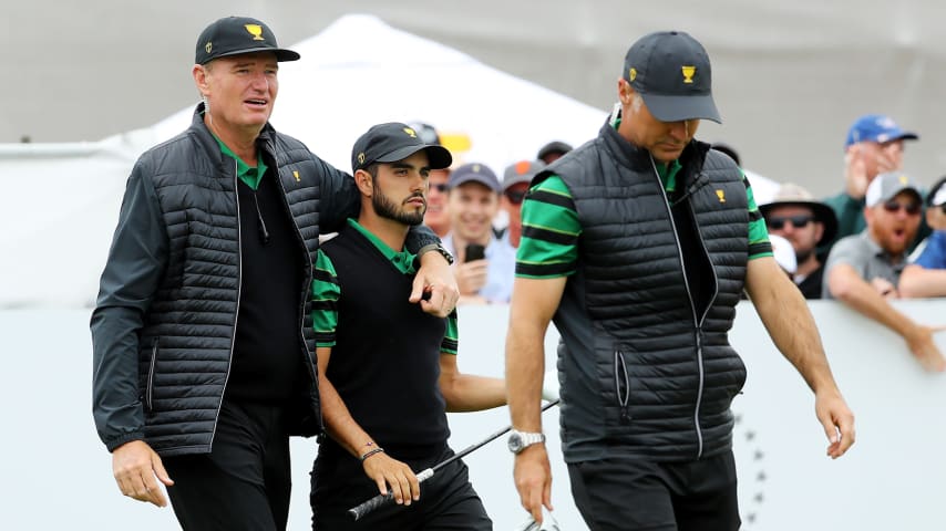 MELBOURNE, AUSTRALIA - DECEMBER 15:  Captain Ernie Els of South Africa and the International team walks with Abraham Ancer of Mexico and the International team and Assistant Captain Trevor Immelman of South Africa and the International team during Sunday Singles matches on day four of the 2019 Presidents Cup at Royal Melbourne Golf Course on December 15, 2019 in Melbourne, Australia. (Photo by Warren Little/Getty Images)