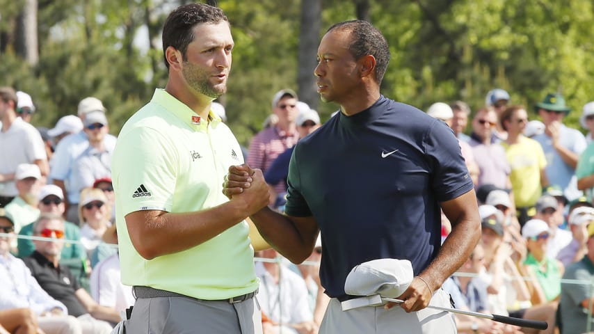 AUGUSTA, GEORGIA - APRIL 11: Jon Rahm of Spain shakes hands with Tiger Woods of the United States on the 18th green during the first round of the Masters at Augusta National Golf Club on April 11, 2019 in Augusta, Georgia. (Photo by Kevin C. Cox/Getty Images)