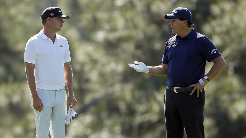 AUGUSTA, GEORGIA - APRIL 10: Phil Mickelson of the United States talks with Keith Mitchell of the United States and Jon Rahm of Spain during a practice round prior to the Masters at Augusta National Golf Club on April 10, 2019 in Augusta, Georgia. (Photo by Kevin C. Cox/Getty Images)