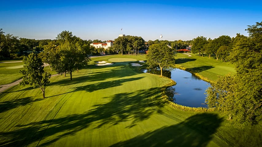 The finishing hole to the outward nine is a big par 4 that also plays into the prevailing wind. The tee shot must split two fairway bunkers, leaving a mid-to-long iron into a huge, sloping green. The best play here is a drive between the two fairway bunkers that lands short of a third bunker. This requires players to work the ball, though working it too much could bring trouble. The green is one of the most sinister on the course with right-to-left and back-to-front breaks and a myriad of little shelves. Even the best will three-putt this green from time to time.