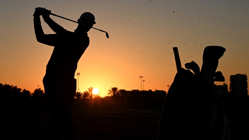 ABU DHABI, UNITED ARAB EMIRATES - JANUARY 17: A silhouette of Erik van Rooyen of South Africa as he warms up on the range ahead of his Round Two match during Day Two of the Abu Dhabi HSBC Championship at Abu Dhabi Golf Club on January 17, 2020 in Abu Dhabi, United Arab Emirates. (Photo by Ross Kinnaird/Getty Images)