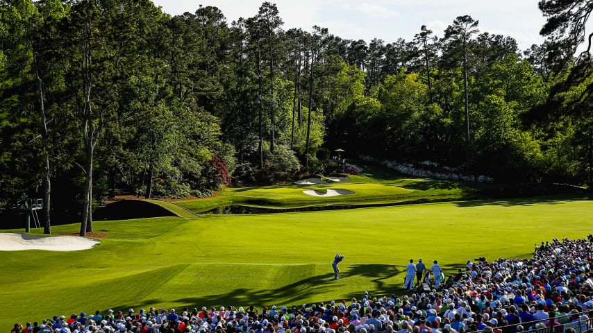 AUGUSTA, GA - APRIL 11: Jordan Spieth of the United States hits his tee shot on the 12th hole as Charley Hoffman of the United States looks on during the third round of the 2015 Masters Tournament at Augusta National Golf Club on April 11, 2015 in Augusta, Georgia.  (Photo by Ezra Shaw/Getty Images)