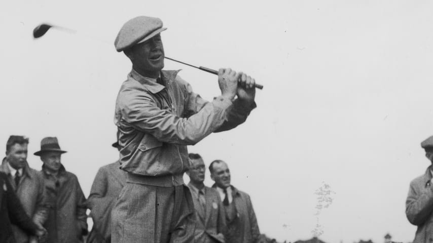30th June 1937:  American golfer, Byron Nelson driving off during his match in the Ryder Cup.  The USGA repetitive ball-testing machine is named 'Iron Byron' after him. He won two Masters, two USPGA and one US Open Championship before WW II intervened.  (Photo by Fox Photos/Getty Images)