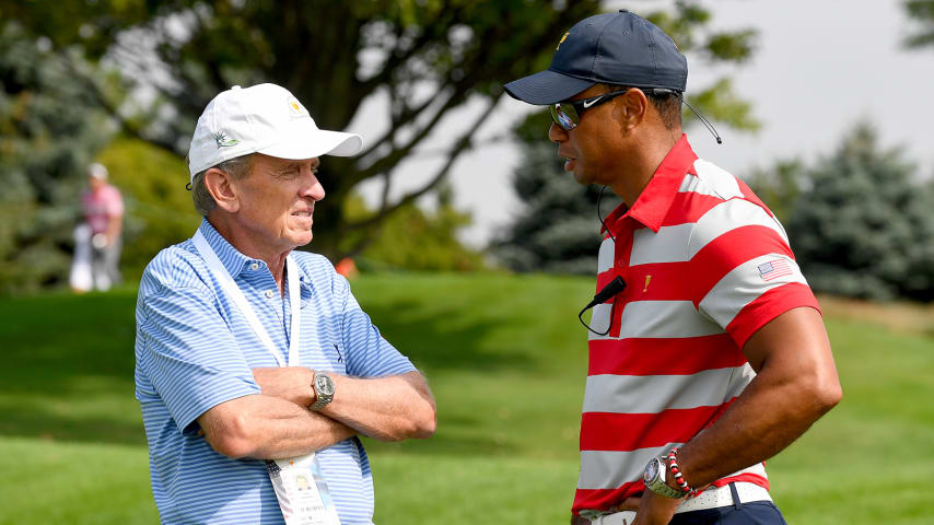 JERSEY CITY, NJ - SEPTEMBER 26: Tim Finchem and Tiger Woods, Captains Assistant of the U.S. Team, talk prior to the start of the Presidents Cup at Liberty National Golf Club on September 26, 2017, in Jersey City, New Jersey. (Photo by Chris Condon/PGA TOUR)