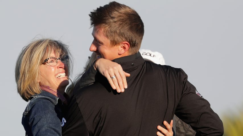 ST SIMONS ISLAND, GA - NOVEMBER 21:  Mackenzie Hughes of Canada celebrates with his mother Sandra and wife Jenna after winning the playoff in the final round of the RSM Classic at Sea Island Resort Seaside Course on November 21, 2016 in St Simons Island, Georgia.  (Photo by Streeter Lecka/Getty Images)