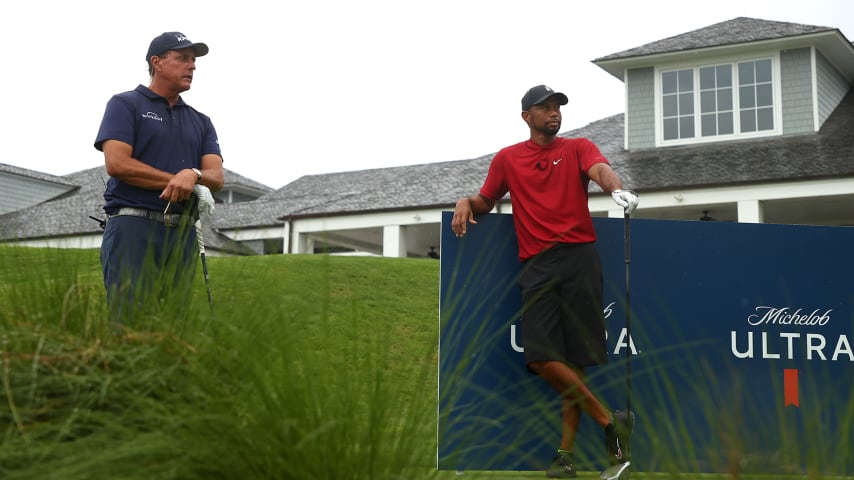 HOBE SOUND, FLORIDA - MAY 24: Phil Mickelson and Tiger Woods wait to play from the tenth tee during The Match: Champions For Charity at Medalist Golf Club on May 24, 2020 in Hobe Sound, Florida. (Photo by Mike Ehrmann/Getty Images for The Match)