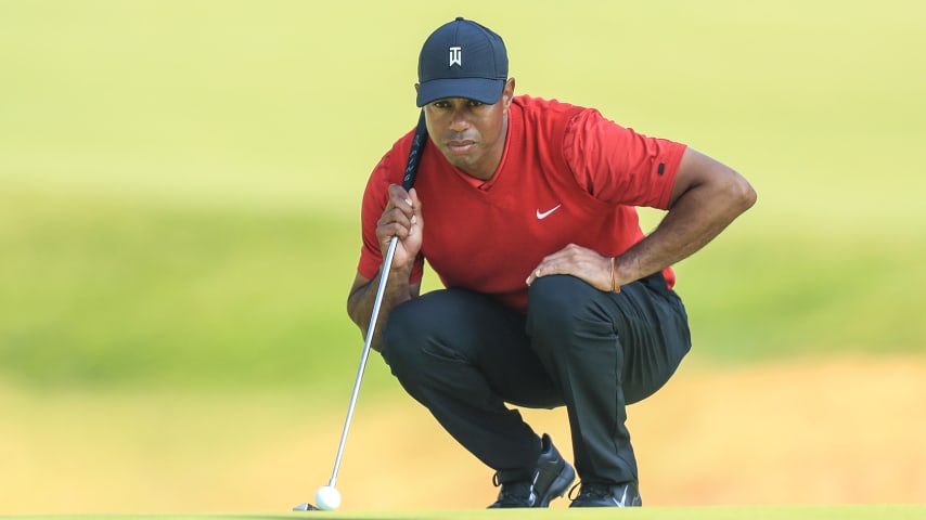 PACIFIC PALISADES, CALIFORNIA - FEBRUARY 16: Tiger Woods of the United States lines up a putt on the par 4, 12th hole during the final round of the Genesis Invitational at The Riviera Country Club on February 16, 2020 in Pacific Palisades, California. (Photo by David Cannon/Getty Images)