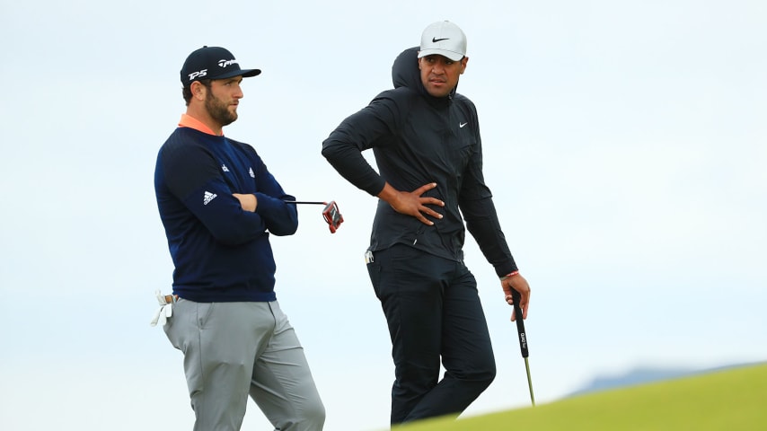 PORTRUSH, NORTHERN IRELAND - JULY 21: Jon Rahm of Spain (L) and Tony Finau of the United States (R) look on, on the fifth green during the final round of the 148th Open Championship held on the Dunluce Links at Royal Portrush Golf Club on July 21, 2019 in Portrush, United Kingdom. (Photo by Mike Ehrmann/Getty Images)