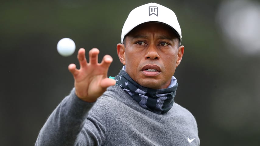 SAN FRANCISCO, CALIFORNIA - AUGUST 04:  Tiger Woods of the United States catches a ball during a practice round prior to the 2020 PGA Championship at TPC Harding Park on August 04, 2020 in San Francisco, California. (Photo by Tom Pennington/Getty Images)