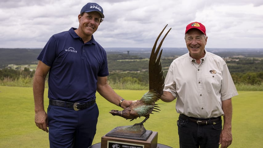 BRANSON, MO - AUGUST 26:  Phil Mickelson of the United States and Johnny Morris, founder and CEO of Bass Pro Shops, pose with the tournament trophy after the final round of the Charles Schwab Series at Ozarks National on August 26, 2020 in Branson, Missouri. Mickelson, playing in his Champion's Tour debut, won the tournament finishing with a score of 22 under par. (Photo by Brett Carlsen/Getty Images)