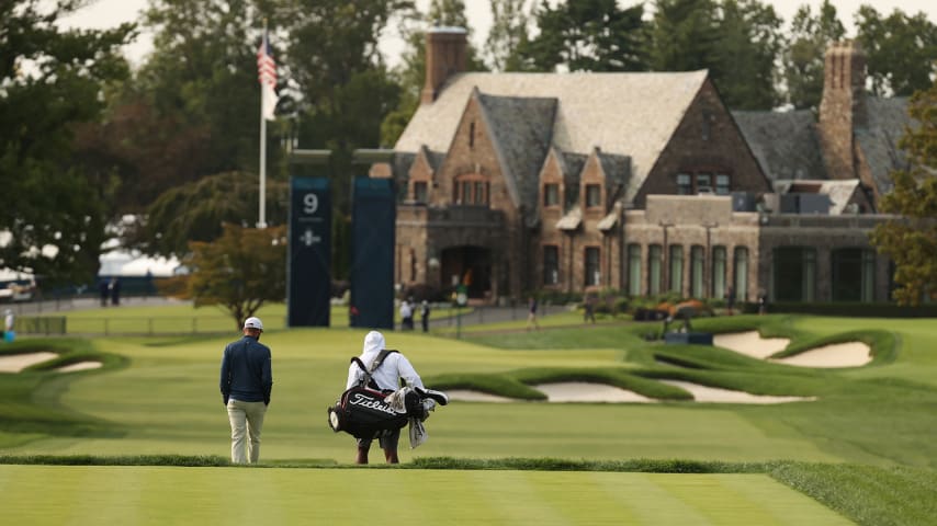 MAMARONECK, NEW YORK - SEPTEMBER 15: Troy Merritt of the United States walks with his caddie down the ninth fairway toward the clubhouse during a practice round prior to the 120th U.S. Open Championship on September 15, 2020 at Winged Foot Golf Club in Mamaroneck, New York. (Photo by Gregory Shamus/Getty Images)