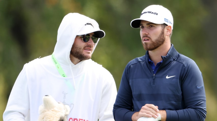 MAMARONECK, NEW YORK - SEPTEMBER 20: Matthew Wolff (R) of the United States and caddie Nick Heinen (L) talk on the first green during the final round of the 120th U.S. Open Championship on September 20, 2020 at Winged Foot Golf Club in Mamaroneck, New York. (Photo by Jamie Squire/Getty Images)