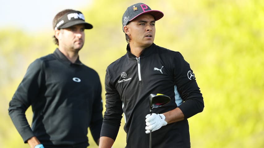 FARMINGDALE, NEW YORK - MAY 16: Rickie Fowler of the United States watches his tee shot from the 10th hole as Bubba Watson of the United States looks on during the first round of the 2019 PGA Championship at the Bethpage Black course on May 16, 2019 in Farmingdale, New York. (Photo by Patrick Smith/Getty Images)