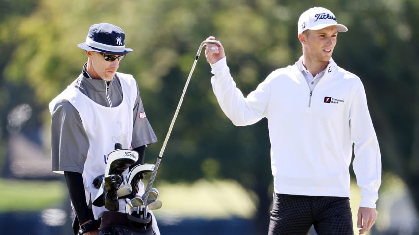 MAMARONECK, NEW YORK - SEPTEMBER 20: Will Zalatoris of the United States stands alongside his caddie Ryan Goble (L) as he pulls a club on the first hole during the final round of the 120th U.S. Open Championship on September 20, 2020 at Winged Foot Golf Club in Mamaroneck, New York. (Photo by Jamie Squire/Getty Images)