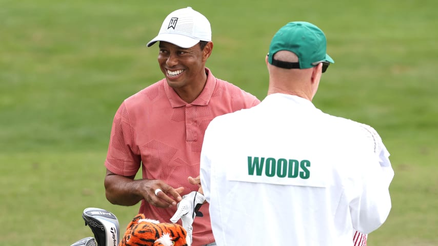 AUGUSTA, GEORGIA - NOVEMBER 10: Tiger Woods of the United States talks with his caddie Joe LaCava on the range during a practice round prior to the Masters at Augusta National Golf Club on November 10, 2020 in Augusta, Georgia. (Photo by Jamie Squire/Getty Images)