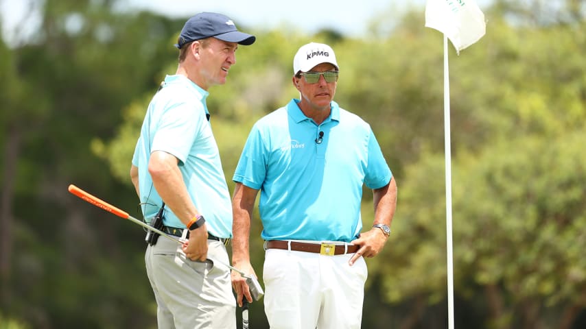 HOBE SOUND, FLORIDA - MAY 23: Former NFL player Peyton Manning and Phil Mickelson look on during a practice round for The Match: Champions For Charity at Medalist Golf Club on May 23, 2020 in Hobe Sound, Florida. (Photo by Mike Ehrmann/Getty Images for The Match)