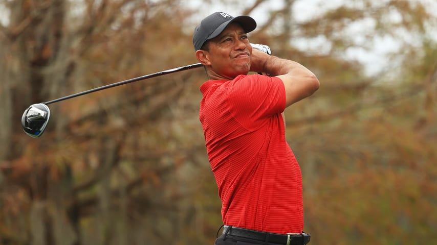 ORLANDO, FLORIDA - DECEMBER 20: Tiger Woods of the United States plays his shot from the ninth tee during the final round of the PNC Championship at the Ritz-Carlton Golf Club Orlando on December 20, 2020 in Orlando, Florida. (Photo by Mike Ehrmann/Getty Images)