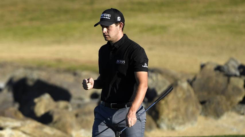 LA QUINTA, CALIFORNIA - JANUARY 24: Patrick Cantlay reacts to a birdie putt on the 18th hole during the final round of The American Express tournament on the Stadium course at PGA West on January 24, 2021 in La Quinta, California. (Photo by Harry How/Getty Images)