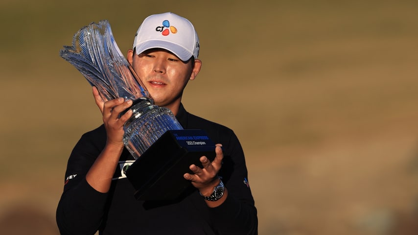 LA QUINTA, CALIFORNIA - JANUARY 24: Si Woo Kim of South Korea poses with the trophy after putting in to win on the 18th green during the final round of The American Express tournament on the Stadium course at PGA West on January 24, 2021 in La Quinta, California. (Photo by Sean M. Haffey/Getty Images)