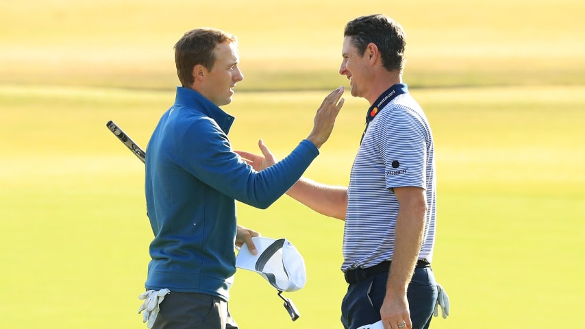 CARNOUSTIE, SCOTLAND - JULY 20: Jordan Spieth of the United States (L) shakes hands with Justin Rose of England on the 18th green during the second round of the 147th Open Championship at Carnoustie Golf Club on July 20, 2018 in Carnoustie, Scotland. (Photo by Andrew Redington/Getty Images)