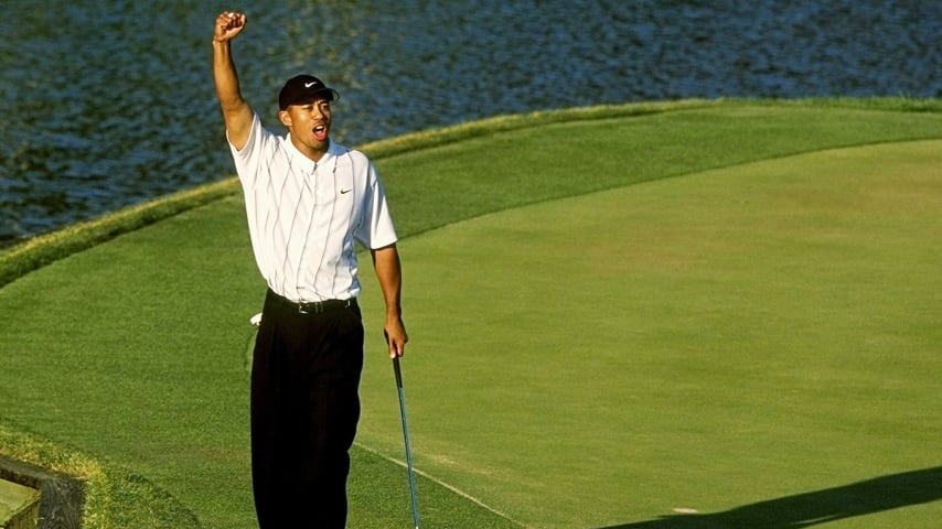 PONTE VEDRA BEACH, FLORIDA - MARCH 24: Tiger Woods celebrates making his âBetter than mostâ putt at the 17th hole during the third round of The PLAYERS Championship at the TPC Stadium course on March 24, 2001 in Ponte Vedra Beach, Florida. (Photo by Stan Badz/PGA TOUR via Getty Images)