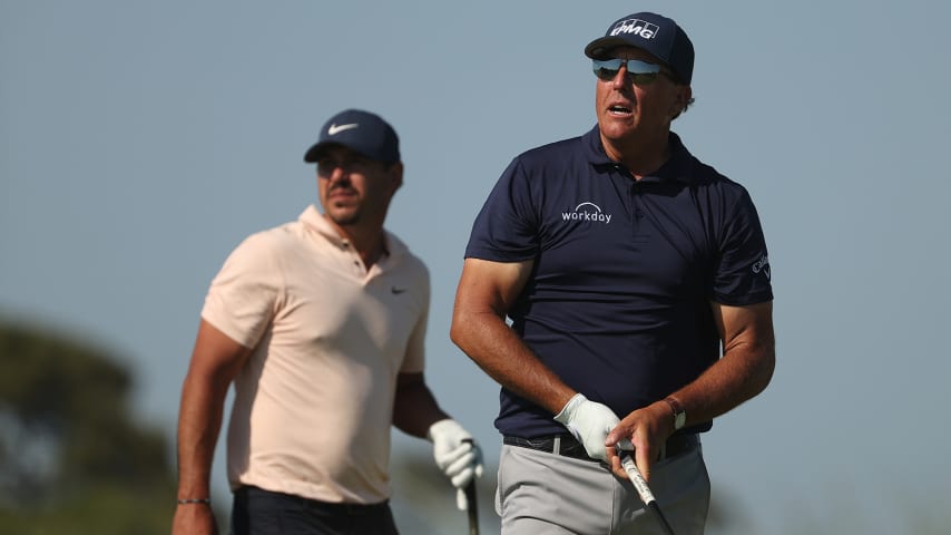 KIAWAH ISLAND, SOUTH CAROLINA - MAY 23: Phil Mickelson of the United States and Brooks Koepka of the United States watch a shot on the 11th hole together during the final round of the 2021 PGA Championship held at the Ocean Course of Kiawah Island Golf Resort on May 23, 2021 in Kiawah Island, South Carolina. (Photo by Patrick Smith/Getty Images)