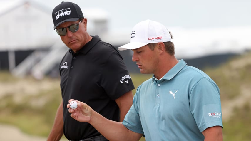 KIAWAH ISLAND, SOUTH CAROLINA - MAY 19: Phil Mickelson of the United States and Bryson DeChambeau of the United States walk off the tenth hole during a practice round prior to the 2021 PGA Championship at Kiawah Island Resort's Ocean Course on May 19, 2021 in Kiawah Island, South Carolina. (Photo by Jamie Squire/Getty Images)