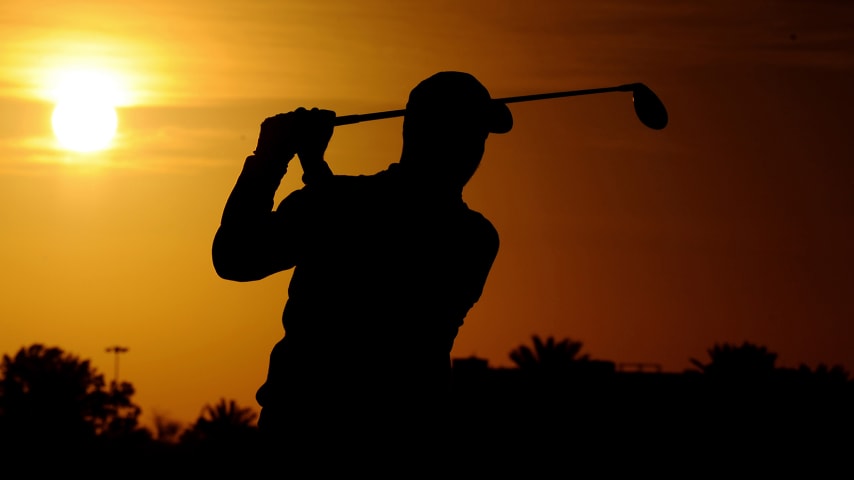 ABU DHABI, UNITED ARAB EMIRATES - JANUARY 19: A silhouette of David Howell of England as he warms up on the range ahead of Day Four of the Abu Dhabi HSBC Championship at Abu Dhabi Golf Club on January 19, 2020 in Abu Dhabi, United Arab Emirates. (Photo by Alex Burstow/Getty Images)