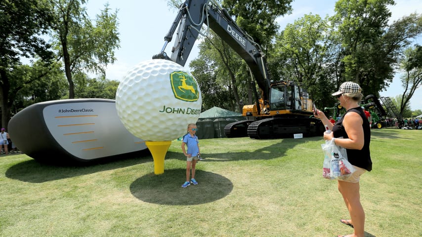 SILVIS, ILLINOIS - JULY 13:  Fans take pictures in front of a tractor during the third round of the John Deere Classic at TPC Deere Run on July 13, 2019 in Silvis, Illinois. (Photo by Dylan Buell/Getty Images)