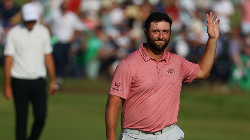SANDWICH, ENGLAND - JULY 18: Jon Rahm of Spain acknowledges the fans as he approaches the green of the 18th hole during Day Four of The 149th Open at Royal St Georgeâs Golf Club on July 18, 2021 in Sandwich, England. (Photo by Andrew Redington/Getty Images)