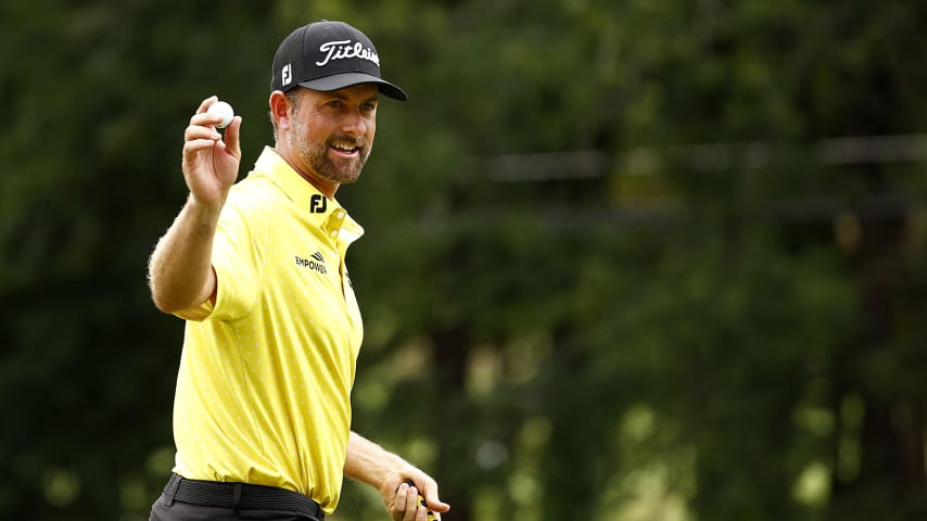 GREENSBORO, NORTH CAROLINA - AUGUST 15: Webb Simpson of the United States acknowledges the crowd with a ball wave after holing out from the fairway on the 11th hole during the final round of the Wyndham Championship at Sedgefield Country Club on August 15, 2021 in Greensboro, North Carolina. (Photo by Jared C. Tilton/Getty Images)