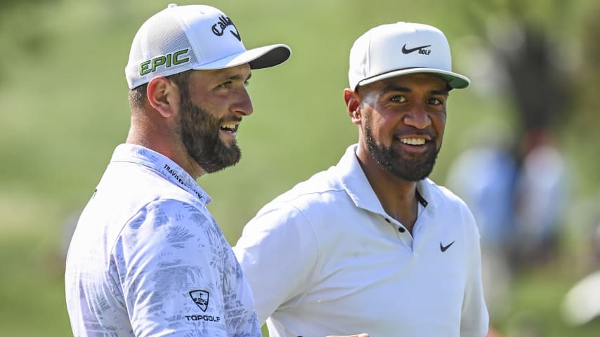 OWINGS MILLS, MD - AUGUST 26:  Tony Finau and Jon Rahm of Spain smile after they both made birdie putts on the 17th hole green during the first round of the BMW Championship, the second event of the FedExCup Playoffs, at Caves Valley Golf Club on August 26, 2021 in Owings Mills, Maryland. (Photo by Keyur Khamar/PGA TOUR via Getty Images)