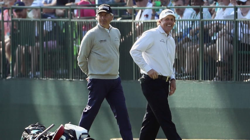 AUGUSTA, GA - APRIL 03: Phil Mickelson of the United States and Fred Couples of the United States walk across a green during a practice round prior to the start of the 2018 Masters Tournament at Augusta National Golf Club on April 3, 2018 in Augusta, Georgia.  (Photo by Jamie Squire/Getty Images)