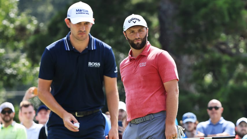 ATLANTA, GEORGIA - SEPTEMBER 05: Jon Rahm of Spain and Patrick Cantlay of the United States on the seventh green during the final round of the TOUR Championship at East Lake Golf Club on September 05, 2021 in Atlanta, Georgia. (Photo by Sam Greenwood/Getty Images)