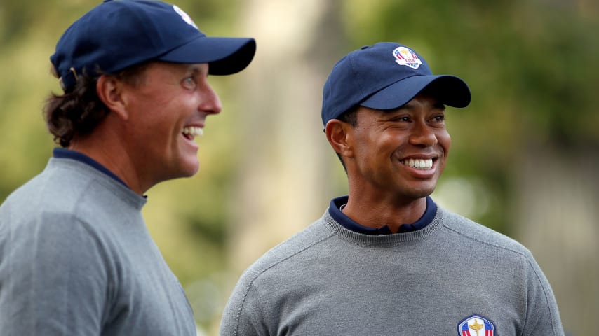 MEDINAH, IL - SEPTEMBER 25:  Tiger Woods and Phil Mickelson of the USA share a joke during the second preview day of The 39th Ryder Cup at Medinah Country Golf Club on September 25, 2012 in Medinah, Illinois.  (Photo by Jamie Squire/Getty Images)