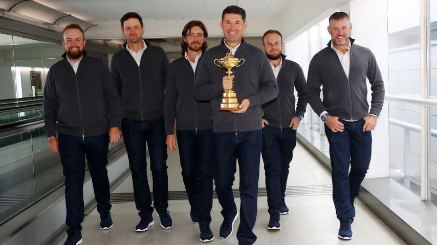 LONDON, ENGLAND - SEPTEMBER 20: (L-R)Shane Lowry, Bernd Wiesberger, Tommy Fleetwood, Captain Padraig Harrington, Tyrrell Hatton and Lee Westwood of Team Europe walk to the gate with the Ryder Cup trophy before departing Heathrow Airport ahead of the 43rd Ryder Cup on September 20, 2021 in London, England. (Photo by Andrew Redington/Getty Images)