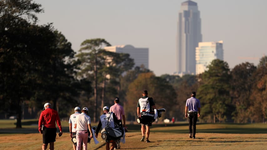 HOUSTON, TEXAS - NOVEMBER 07: Doc Redman, Mark Hubbard and Sean O'Hair of the United States walk with their caddies on the first hole during the third round of the Houston Open at Memorial Park Golf Course on November 07, 2020 in Houston, Texas. (Photo by Carmen Mandato/Getty Images)